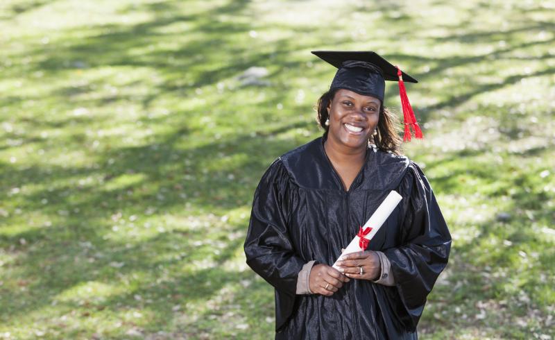 female graduate in cap and gown
