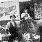 Man and boy by bakery wagon in the 1900's